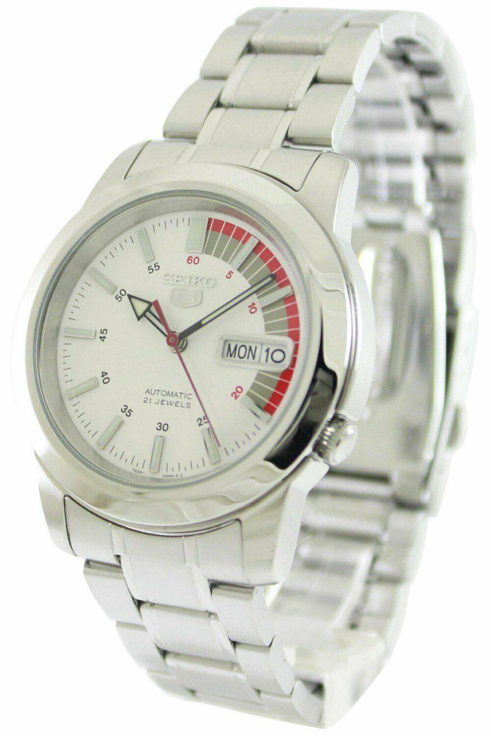 Seiko 5 Automatic 21 Jewels SNKK25 SNKK25K Water Resistant. A brand-new Seiko watch featuring a Stainless steel strap. Side view.