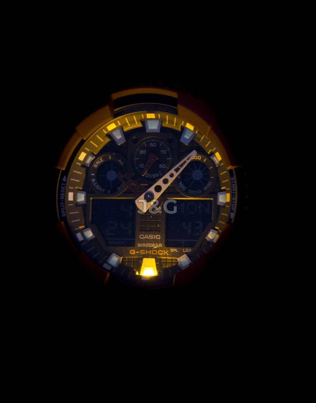 Casio G-Shock Male GA-100B-4A. A brand-new Casio G-Shock watch. Angled view. - view 2