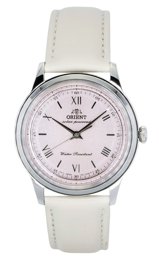 Orient Bambino Leather Strap Pink Dial Solar Water Resistant. A brand-new Orient Bambino watch featuring a Pink dial and a Leather strap. Front view.