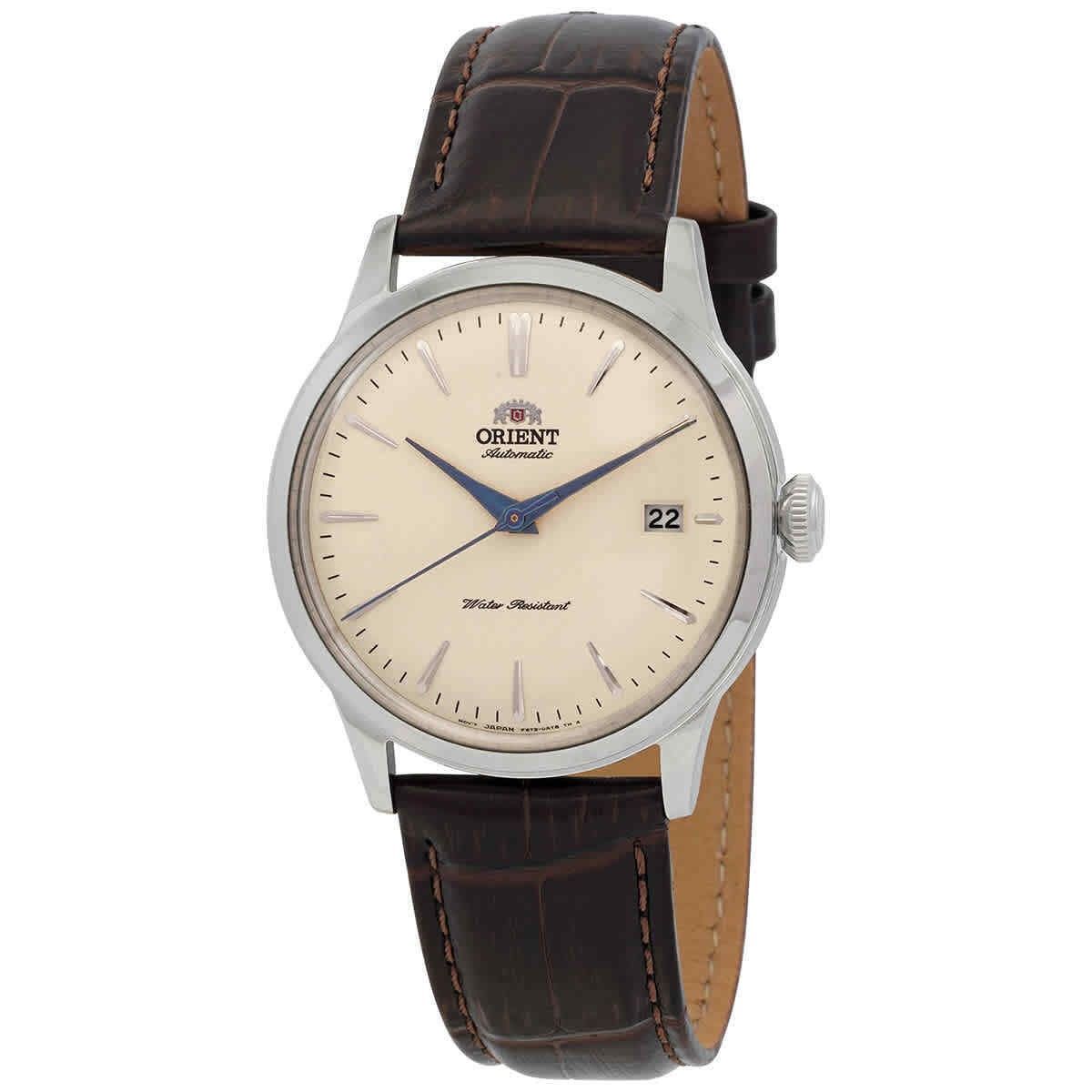 Orient Classic Bambino Champagne Dial Automatic. A brand-new Orient Bambino watch featuring a Champagne dial and a Leather strap. Side view.