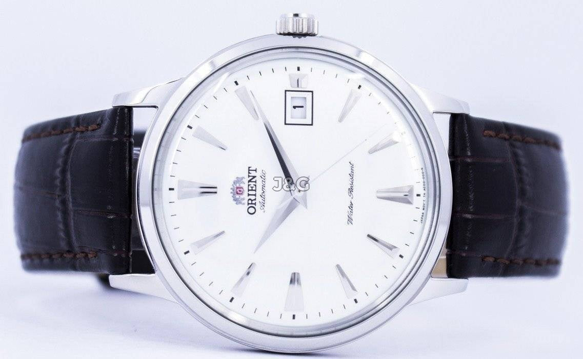 Orient Bambino Automatic movement White Leather Male FAC00005W0. A brand-new Orient Bambino watch featuring a White dial and a Leather strap. Angled view. - view 4
