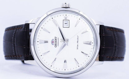 Orient Bambino Automatic movement White Leather Male FAC00005W0. A brand-new Orient Bambino watch featuring a White dial and a Leather strap. Angled view. - view 4
