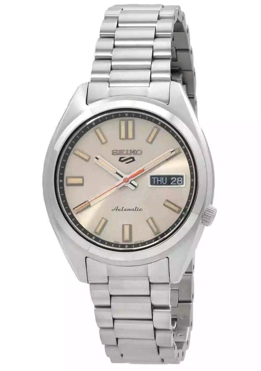 Seiko 5 Sports SNXS Series Stainless Steel Beige Dial. A brand-new Seiko 5 Sports watch featuring a Beige dial and a Stainless steel strap. Angled view.